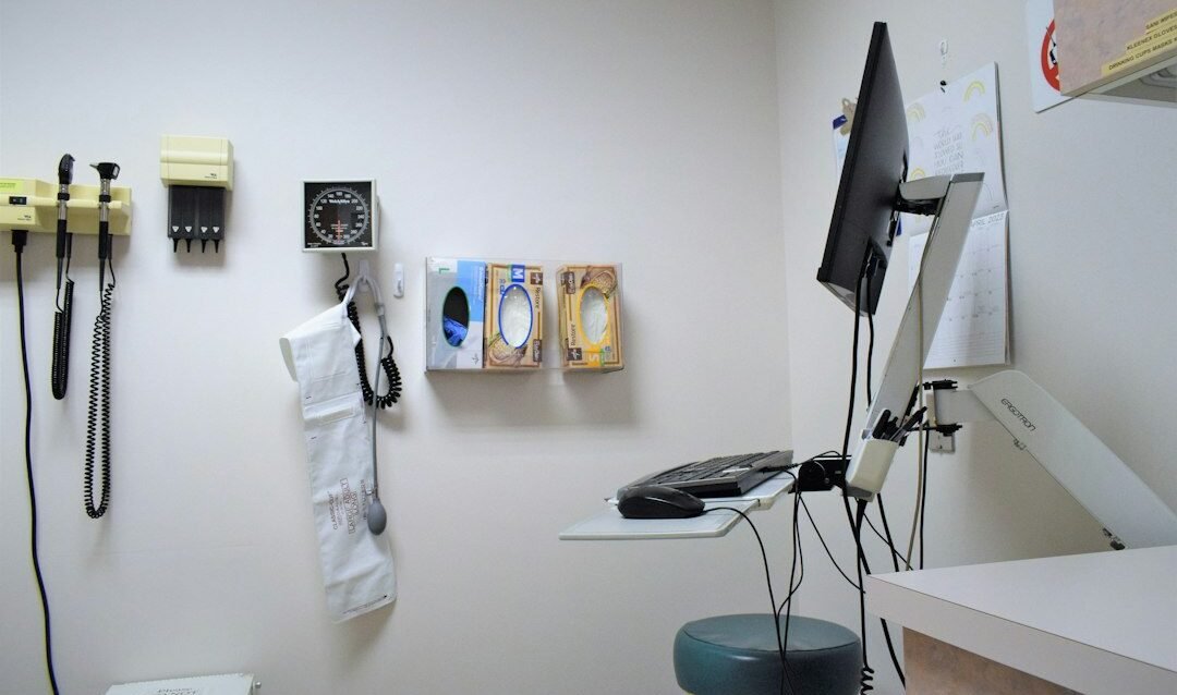 Clinic manager reviewing patient acquisition cost data with a doctor in a modern medical office Clinic manager reviewing patient acquisition cost data with a doctor in a modern medical office