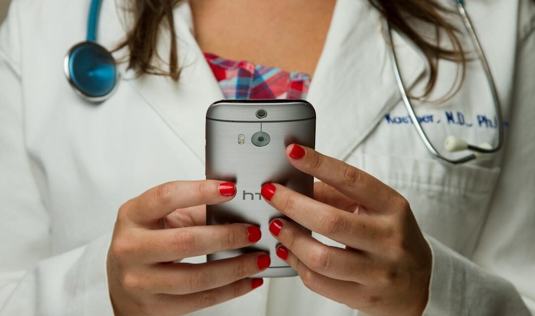 Clinic coordinator replying to an international patient inquiry on a smartphone Clinic coordinator replying to an international patient inquiry on a smartphone